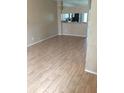 Open-concept living space with neutral walls, tile flooring, and views into the kitchen area at 244 Countryside Key Blvd, Oldsmar, FL 34677