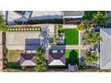 Aerial view showcases lush landscaping, yard, gazebo, and covered parking at 2635 13Th N Ave, St Petersburg, FL 33713