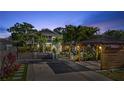 A well-lit home with a landscaped yard, complemented by a gazebo and wood-framed covered parking at 2635 13Th N Ave, St Petersburg, FL 33713