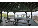 A covered pavilion with picnic tables, perfect for outdoor gatherings and enjoying the surrounding water views at 2802 Old Bayshore Way, Tampa, FL 33611