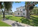 Charming home features a well-manicured lawn and mature trees, creating a serene setting at 3000 19Th S Ave, St Petersburg, FL 33712