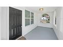 Welcoming front porch with an arched window and door, and neutral colors creating an inviting entry at 3000 19Th S Ave, St Petersburg, FL 33712