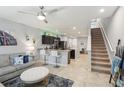 Open concept living room, kitchen, and staircase at 3158 Victoria Inlet Dr, Holiday, FL 34691