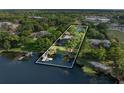Waterfront home boasts a private dock, boat lift, and serene lake views at 3407 W Busch Blvd, Tampa, FL 33618