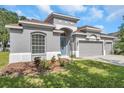 Charming single-Gathering home with a three-car garage and landscaped front yard at 3527 101St E Ave, Parrish, FL 34219
