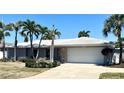Charming single-story home features a well-maintained lawn and a two car garage at 3807 48Th S Ave, St Petersburg, FL 33711