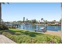 Waterfront property with boat lift, boat dock, lush landscaping and a beautiful view at 3807 48Th S Ave, St Petersburg, FL 33711