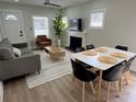 Inviting living room showcasing contemporary decor, an open floor plan, and a view of the fireplace at 3910 N Suwanee Ave, Tampa, FL 33603