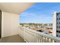 Serene balcony view offering a picturesque panorama of the city, with palm trees and coastline at 450 Treasure Island Cswy # 505, Treasure Island, FL 33706