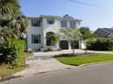 Charming two-story house with a well-kept lawn and a paved driveway at 5009 W Longfellow Ave, Tampa, FL 33629