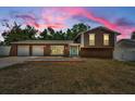Well-maintained home with a three-car garage and a welcoming light-blue front door at 613 Valley Hill Dr, Brandon, FL 33510