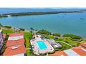 Aerial shot of pool area with lounge seating, covered areas, and views of the bay at 6357 Bahia Del Mar Blvd # 111, St Petersburg, FL 33715