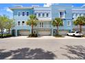 Beautiful three-story condo with an attached garage and a balcony that overlooks the waterfront at 1134 Starfish Ln, Tarpon Springs, FL 34689