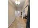Inviting entryway with neutral tile flooring and a view of a dining area featuring hardwood floors at 3907 Applegate Cir, Brandon, FL 33511