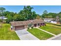 Charming single-story home with a well-manicured lawn and a classic design at 403 Cactus Cir, Seffner, FL 33584