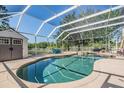 Relaxing screened-in pool area features a covered patio and private backyard at 417 Ventura Dr, Oldsmar, FL 34677