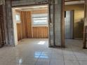 An interior view reveals a space with tiled floors, awaiting customization and design at 4716 W Vasconia St, Tampa, FL 33629