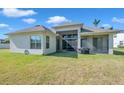 Spacious backyard with a screened-in lanai, perfect for outdoor entertaining at 5518 72Nd E Ter, Ellenton, FL 34222