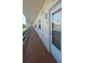 Exterior hallway with condo door entrance featuring apartment number 306 at 5623 80Th N St # 306, St Petersburg, FL 33709