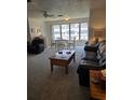 Well-lit living room with lots of natural light and plenty of space for furniture at 5623 80Th N St # 306, St Petersburg, FL 33709