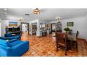Open concept living space with terra cotta tile flooring and stainless steel appliances at 6213 12Th S Ave, Gulfport, FL 33707