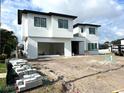 External view of the house in progress showing construction materials and contemporary design at 2867 Sunstream Ln, Clearwater, FL 33759