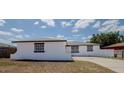 Exterior of the home featuring a driveway leading to a two-car garage at 1204 Croydonwood Cir, Brandon, FL 33510