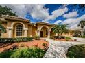 Beautiful front yard landscaping leading to the front entrance of the house at 2042 Diamond Ct, Oldsmar, FL 34677