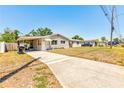 Single-story home with a cozy carport, level lot, and convenient, long driveway at 2639 28Th N Ave, St Petersburg, FL 33713