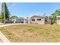 Charming, one-story home with a carport and a well-manicured front lawn at 2639 28Th N Ave, St Petersburg, FL 33713