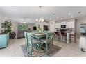 Open-concept kitchen and living space with tile floors and modern decor at 2821 Lytton Hall Dr, Zephyrhills, FL 33540