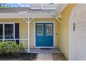 Close-up of a vibrant blue double front door with white trim at 305 Bryan Oak Ave, Brandon, FL 33511