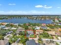Beautiful aerial view of home with large backyard and waterfront views. This home is a must-see! at 349 Belleair Ne Dr, St Petersburg, FL 33704