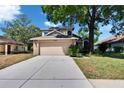 Charming two-story home with a two car garage, brick accents, mature landscaping and spacious driveway at 4225 Barret Ave, Plant City, FL 33566