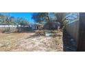 Wide shot of the backyard showing some debris at 4331 16Th S Ave, St Petersburg, FL 33711