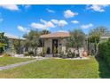 Inviting single-story home with a walkway, manicured lawn, pretty landscaping, and lovely curb appeal at 4829 20Th N Ave, St Petersburg, FL 33713