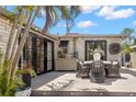 Outdoor patio area with a dining set, nice deck, and views of lush tropical landscaping at 4829 20Th N Ave, St Petersburg, FL 33713