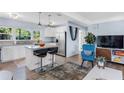 Stylish kitchen with stainless steel appliances, granite countertops, and island with bar seating at 5254 23Rd N Ave, St Petersburg, FL 33710