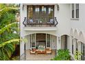 Charming balcony with seating offers a relaxing outdoor space, enhancing the home's appeal at 601 Bosphorous Ave, Tampa, FL 33606