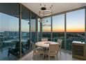 Dining room with luxury chandelier has floor to ceiling windows that offer city views at 777 3Rd N Ave # 1408, St Petersburg, FL 33701