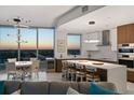 Open floor plan connects living area, kitchen, and dining area with spectacular sunset views at 777 3Rd N Ave # 1408, St Petersburg, FL 33701