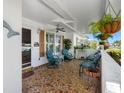Inviting front porch with comfortable seating, stylish decor, and a relaxing atmosphere at 9110 34 N Way, Pinellas Park, FL 33782