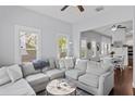 Bright and airy living room featuring a comfortable sectional sofa with great natural light and modern decor at 107 W Amelia Ave, Tampa, FL 33602