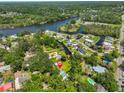Aerial view of property showcasing its proximity to the river and surrounding green landscape at 10824 Palmetto St, Riverview, FL 33569