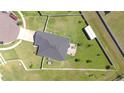 Aerial view of property showing fenced backyard with patio, shed, and mature landscaping at 4444 Devinshire Fields Loop, Plant City, FL 33567