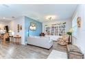 Comfortable living room with ample seating, a built-in bookcase, and lots of natural light at 4444 Devinshire Fields Loop, Plant City, FL 33567