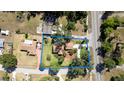 Aerial view of property showcasing the home, landscaping, and lot lines at 4801 Lynn Oaks Cir, Dover, FL 33527