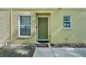 View of the front door of the home, with a welcome mat at 5302 Aloha Seed Dr, Seffner, FL 33584