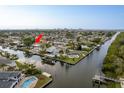 Waterfront property featuring a private pool and direct access to the navigable canal at 8721 Bay Crest Ln, Tampa, FL 33615
