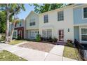 Inviting townhome with charming curb appeal, colorful landscaping, and a cozy entrance at 1728 Mill Run Cir, Tampa, FL 33613